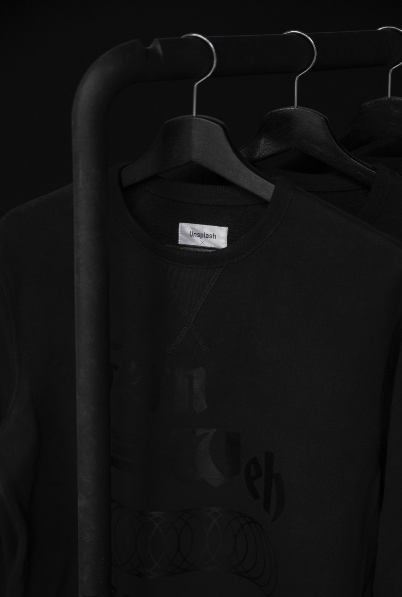 black sweatshirts with an unsplash tag on black hangers, the urban explorer sweatshirt 4k