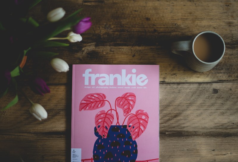 the frankie magazine with a pink cover next to a mug of coffee and a bouquet of tulips, frankie magazine 4k