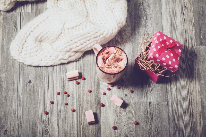 a hot beverage surrounded by berries a knitted item and a gift wrapped box containing straw, _christmas 4k