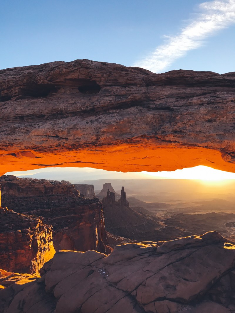 rock formations form a bridge over desert valleys in moab, natural archways 4k
