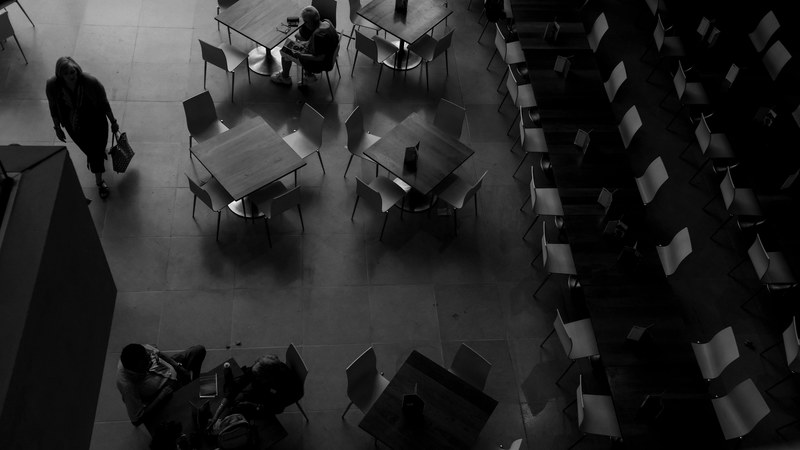 overhead shot of an empty corporate cafe with tables and chairs, empty cafeteria 4k