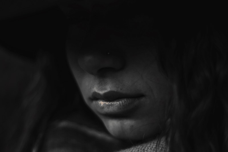 mysterious woman covered in shadow with an unsmiling mouth, mystery woman 4k