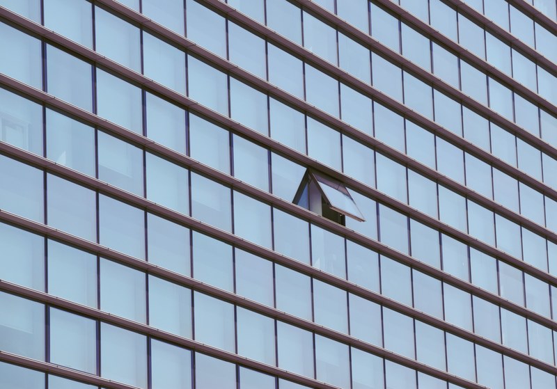 a half open window in a the facade of an office building, open office building window 4k