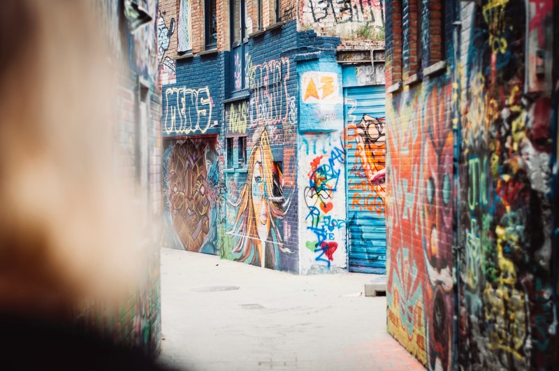 an empty alley in ghent with its walls covered in colorful graffiti, graffiti alley ghent 4k
