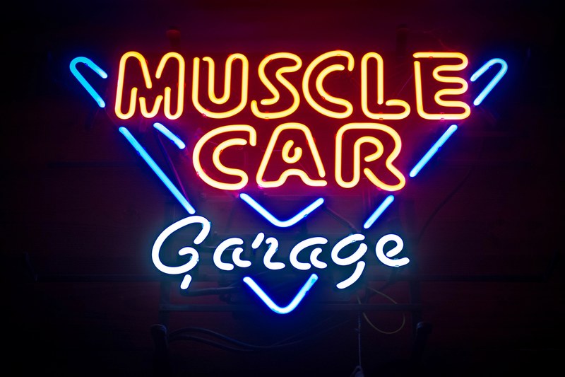 blue and red neon sign for a muscle car garage seen at night, blue and red neon sign 4k