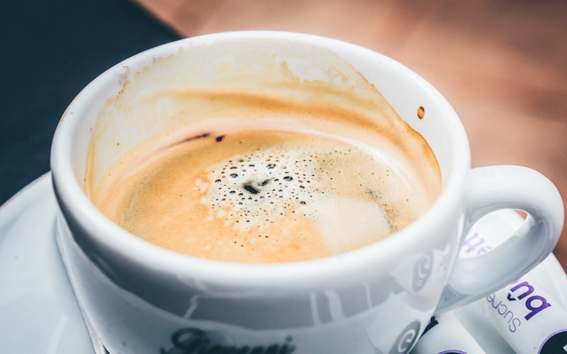 a creamy hot beverage in a small coffee or tea cup, _creamy bubbly hot drink 4k