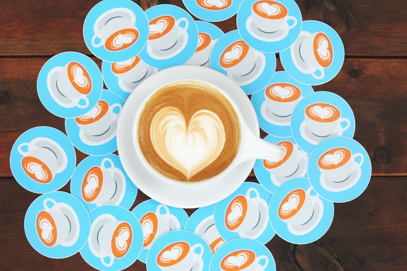 a cup of coffee with latte art in the shape of a heart, love you a latte 4k