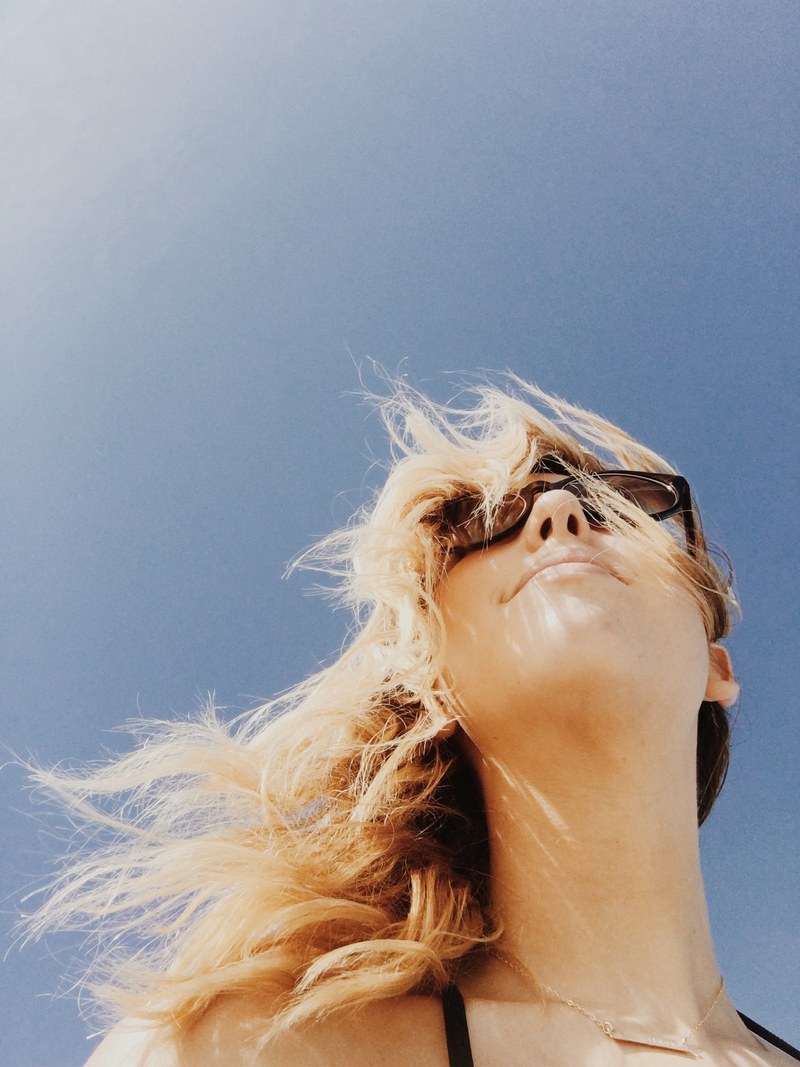 a happy blonde girl wearing glasses outside, _happy blonde girl 4k