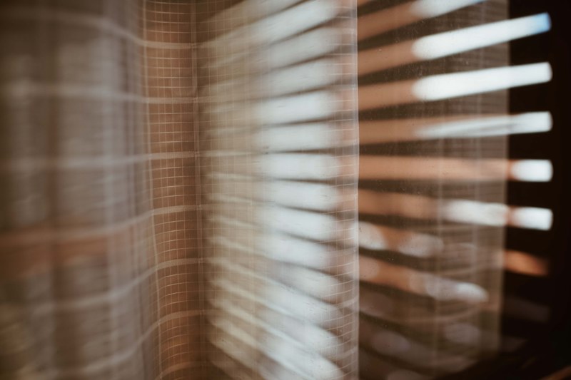 a transparent curtain and shutter blinds at a window, window curtain in front of window blinds 4k
