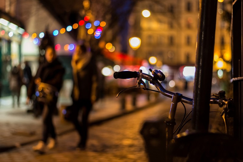 a bike and bell in focus with blurred people and a bokeh effect in the background, bike with bokeh 4k