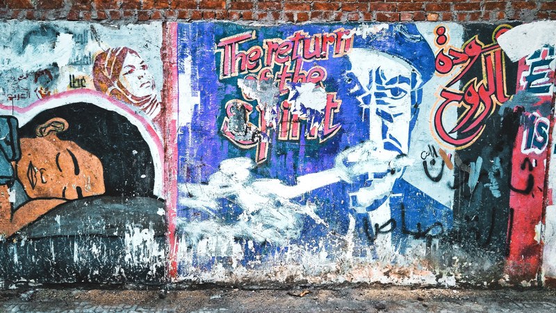 brick wall covered in colorful graffiti art, graffiti on brick wall 4k