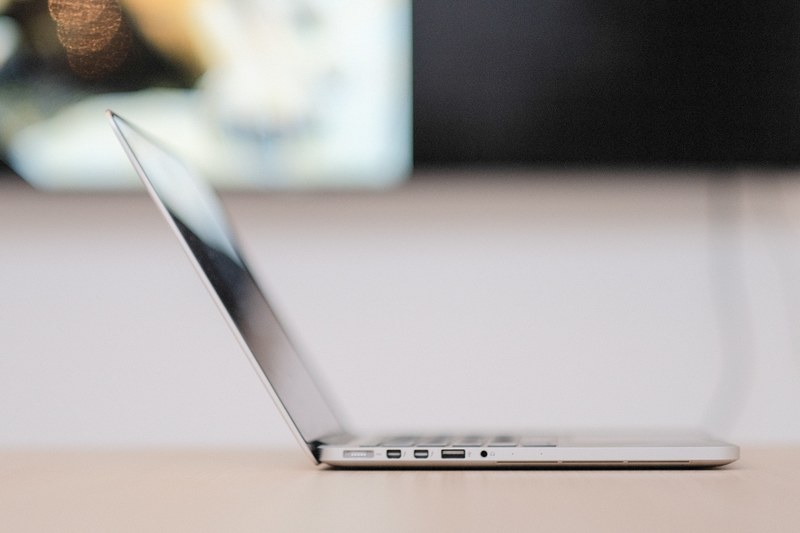 a side shot of an open macbook, macbook from the side 4k