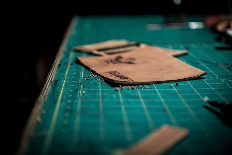 close up of creative cutting board and leather squares in riga, leather on cutting board 4k