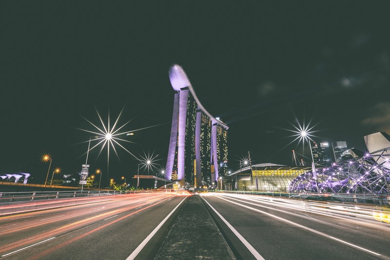 streetlights shine near unique architecture downtown by the highway, highway sculptures 4k