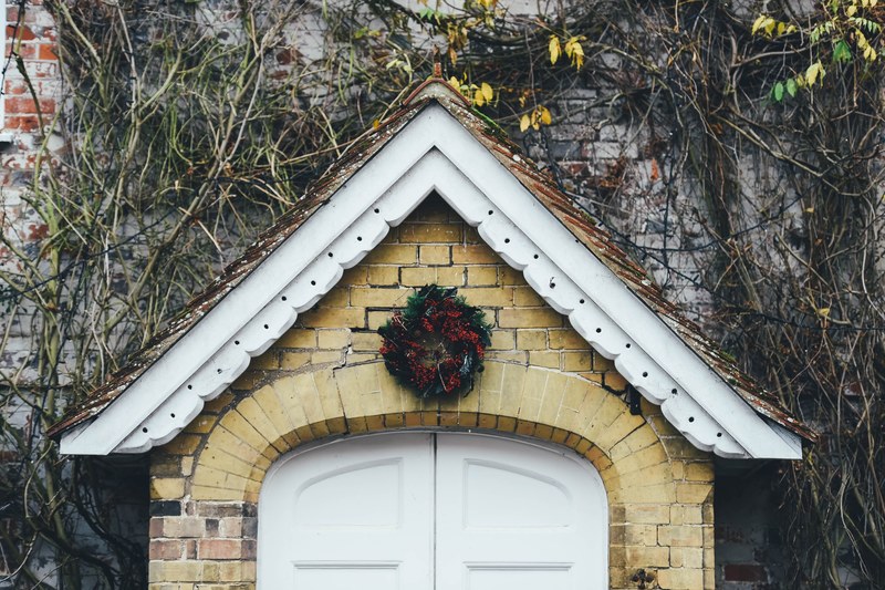 festive doorway holly and wreath 4k