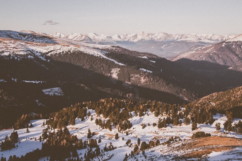 a view overlooking many smaller mountains and forests in italy, italy mountainscape 4k