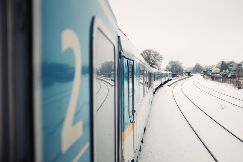 the railway tracks covered in snow as seen from the side of the train, _going home 4k