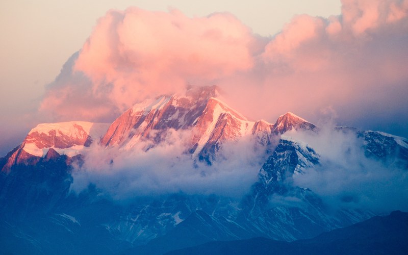 a snowy mountain bathed in pastel colored light during sunset, mountain high 4k