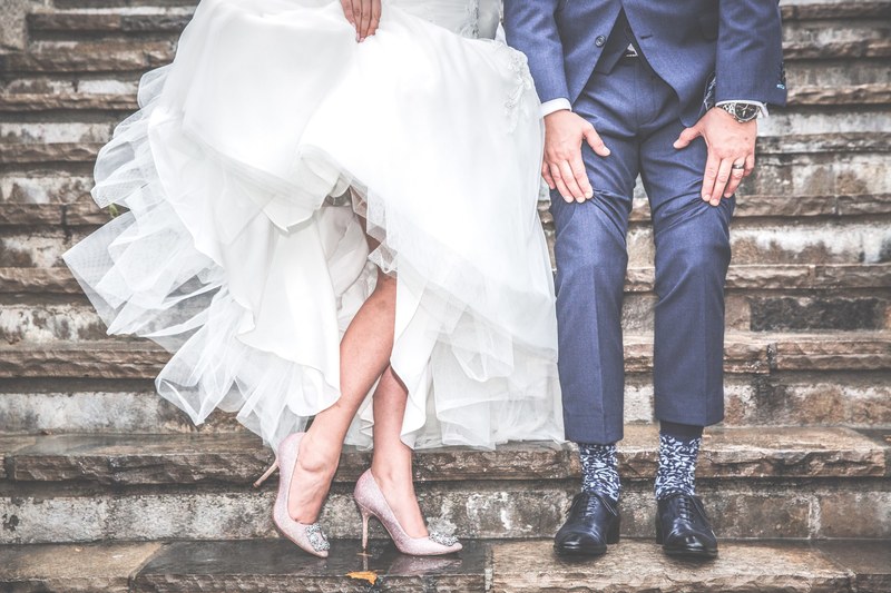 a married couple shows off their wedding dress and suit on steps, _newlyweds legs on stairs cambridge mill 4k