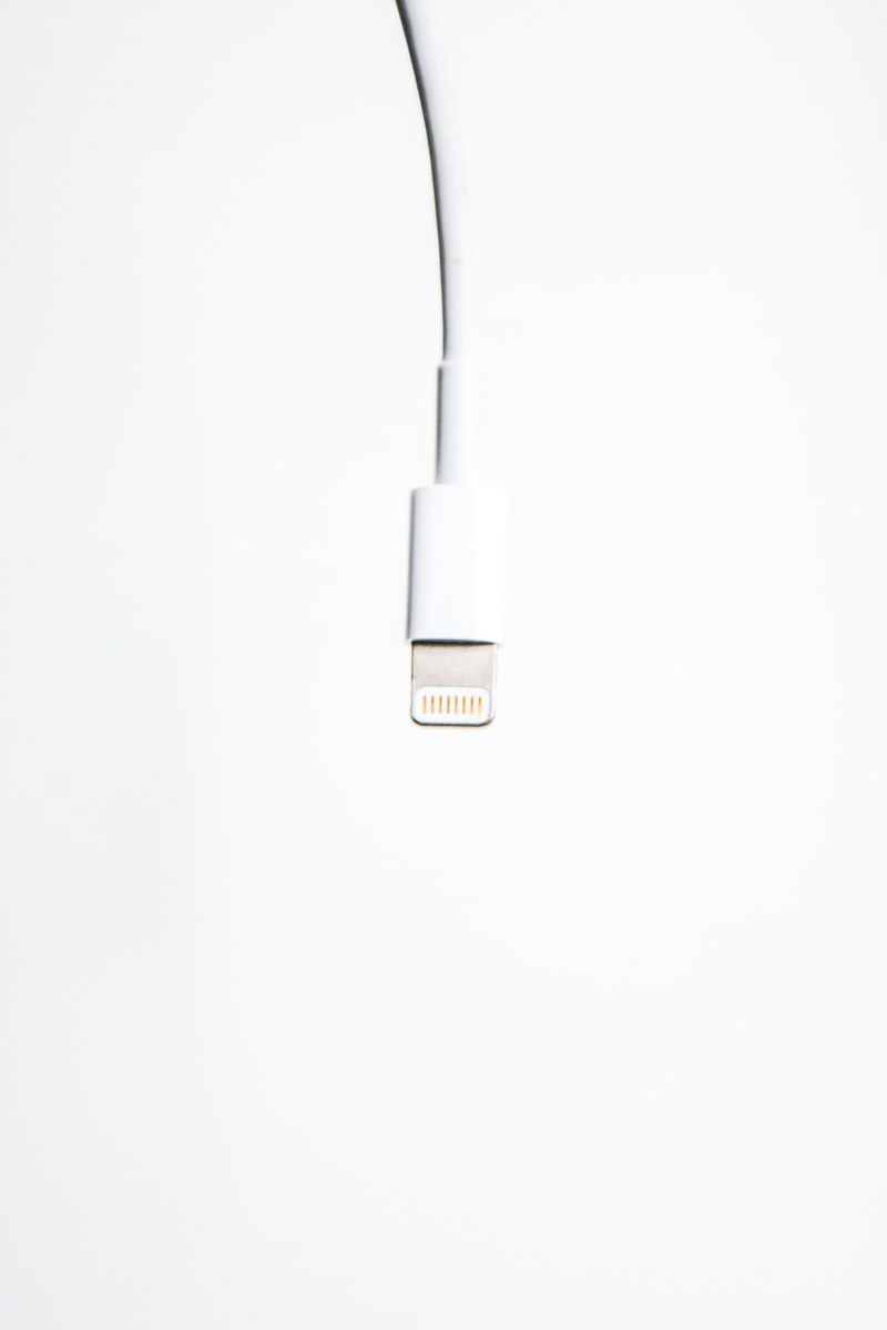 a white usb cord dangling from above, _white usb cable 4k