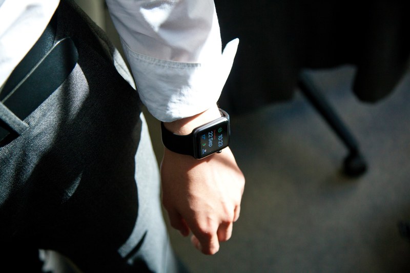 close up of an apple watch on the wrist of an elegantly dressed man, businessman with a smartwatch 4k