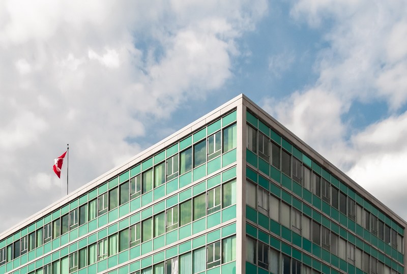 downtown urban waving flag and white cloud 4k