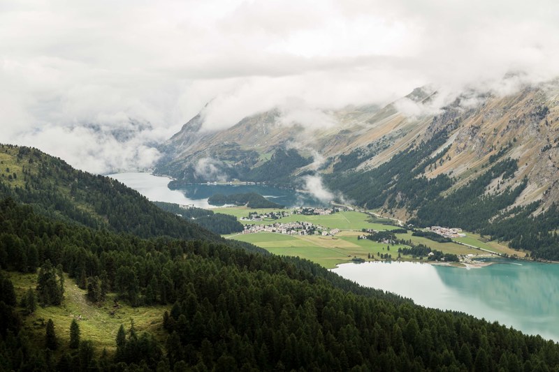 a village between two lakes in a mountain valley, misty mountain 4k