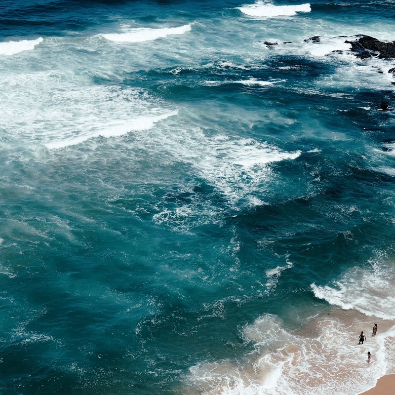 blue sea washing on a sand beach in lisbon, a week in lisbon 4k