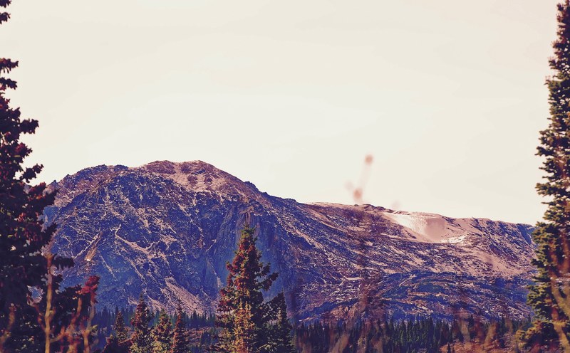 a picturesque mountain scenery under a pale sky, violet mountain 4k