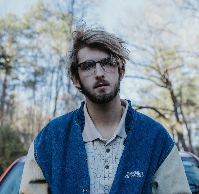 a man with glasses in vanguard vest outdoors, _man vanguard glasses outdoors 4k