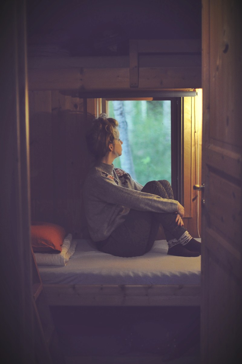 a sad female sitting with her knees up in bed, _before the night came 4k