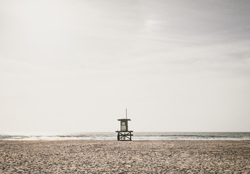 observation tower on a huntington sand beach, day one 4k