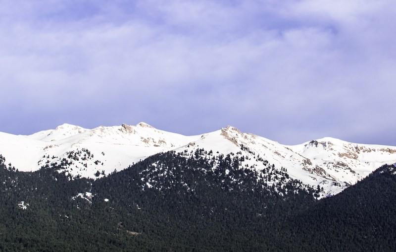 beautiful landscape with snow capped mountains and winter trees, snowy mountain landscape 4k