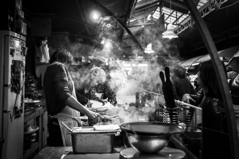 chefs in a steamy kitchen preparing food, restaurant workers 4k