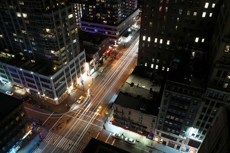 light trails and taxi cabs in the streets of new york at night, nyc streetlife 4k