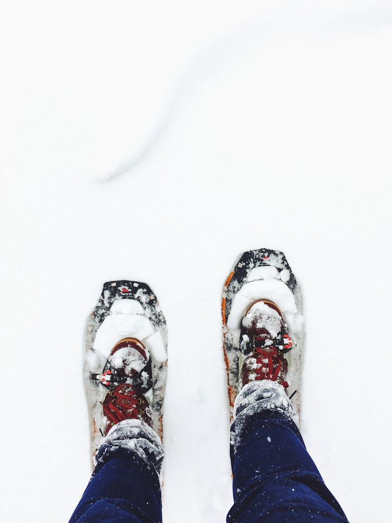 staring down at a pair of winter shoes in the snow in kamas utah, walking in a utah winter 4k