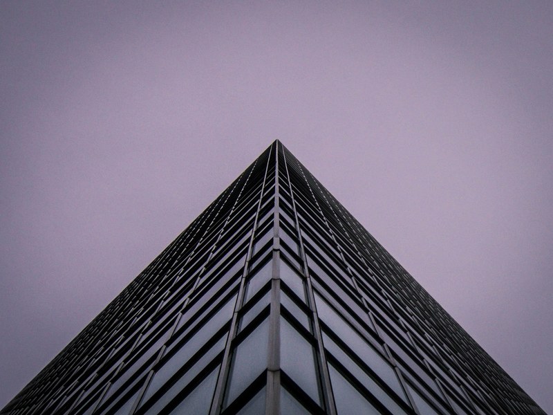a view from beneath the corner top of a skyscraper in montreal, symmetry 4k