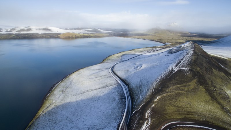 roads through a snowy hilly countryside in iceland, lake in iceland 4k