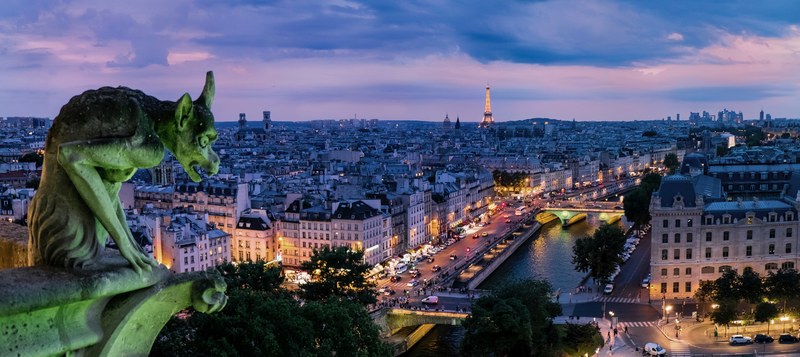a gargoyle statue on the notre dame cathedral overlooking the seine, parisian gargoyle 4k