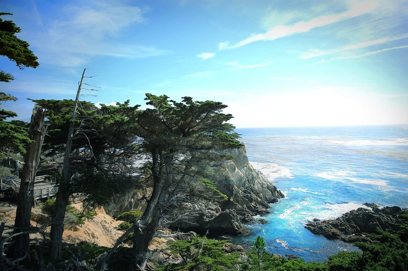 a view from a rocky coast on the vast azure ocean on a sunny day, view from the ocean coast 4k