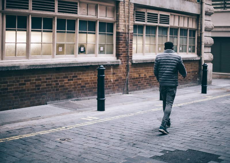 person walking alone down an empty cobblestone street, walk da streets 4k