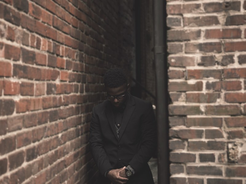 man african american brick and wall 4k