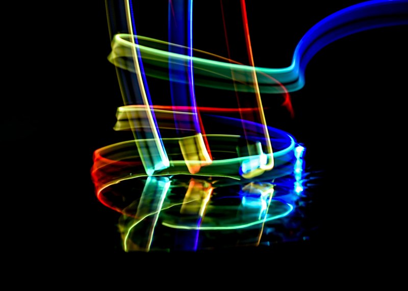 a very colorful light painting consisting of light trails made from red green blue and yellow lights, _colorful light painting 4k