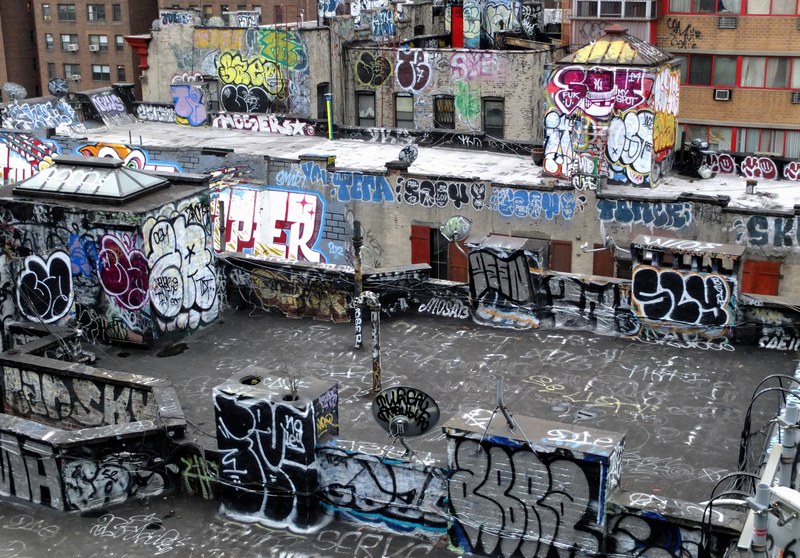 manhattan bridge rooftop and urban buildings covered in colorful graffiti, graffiti covers rooftop 4k