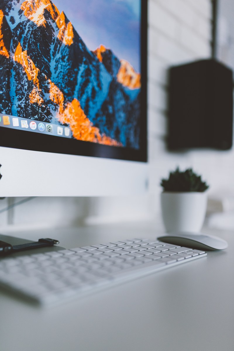 a clean desk with an apple computer and monitor, _office desk keyboard monitor 4k