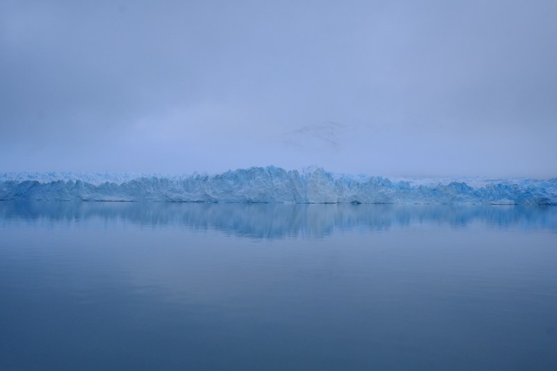 blue glacier under a mist seen from the perspective of ice old water, mist over a glacier 4k