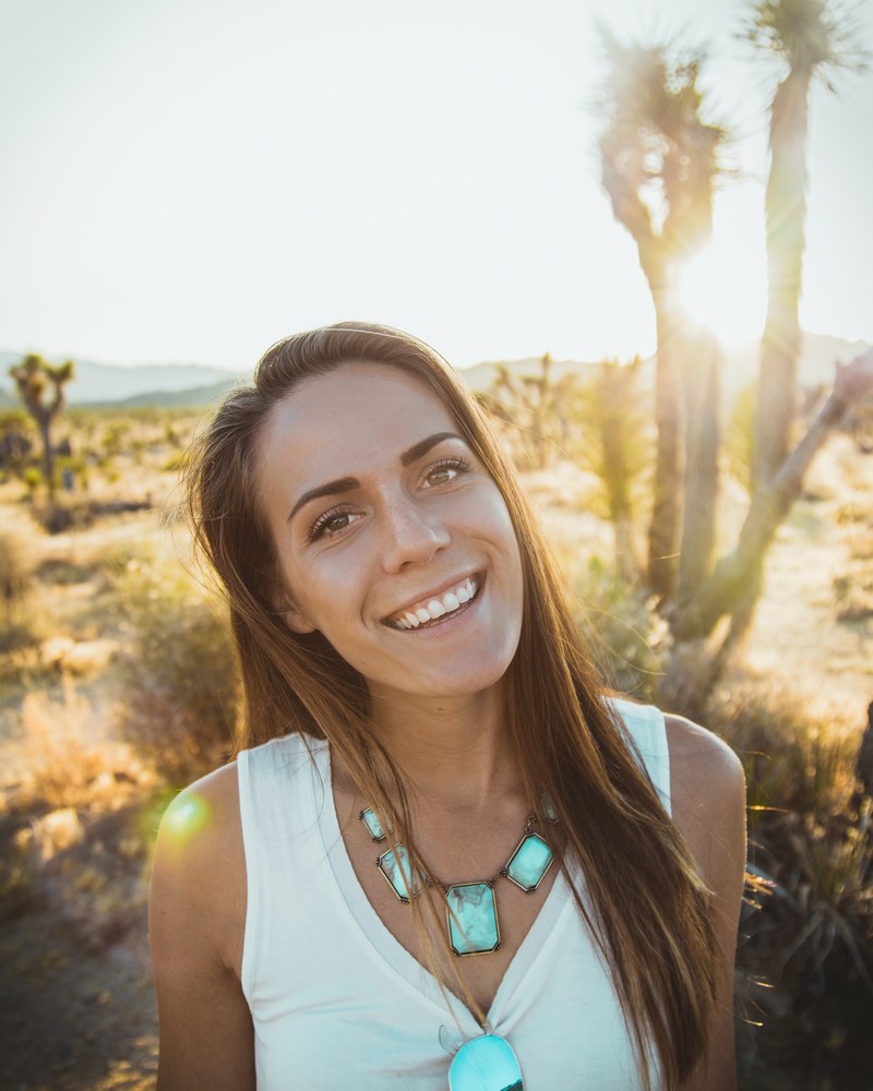 portrait of a smiling happy woman alone in the desert, desert smile 4k
