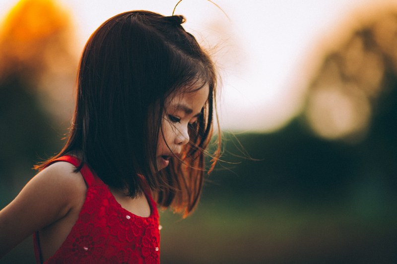 a little girl with a ponytail wearing a red dress, girl in red dress 4k