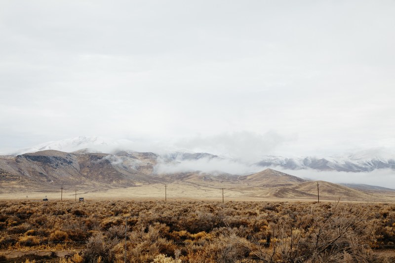 rural roads with power lines sit near snowy mountainsides, rural roads 4k