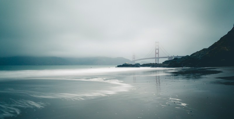 foggy view of golden gate bridge from the shores of baker beach, baker beach in the mist 4k